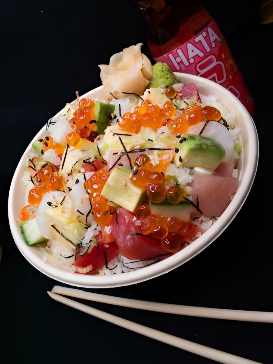 A poke bowl with salmon roe, avocado and tuna